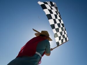 race, aircraft, sky, clouds, airplane-race, flag, checkered, finish, line, outside, man, close-up, nature, blue plane, blue airplane, blue closed