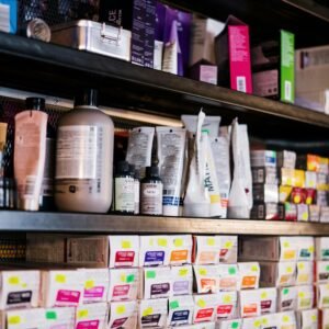 Professional hair products neatly organized on salon shelves, ideal for hairstylists.